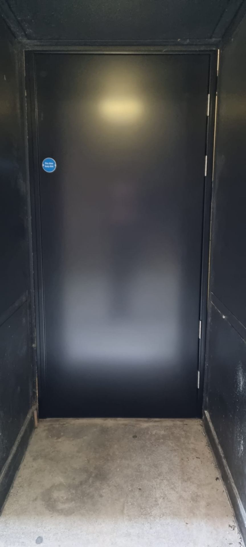 Single steel fire door, satin black with Fire Door Keep Shut signage