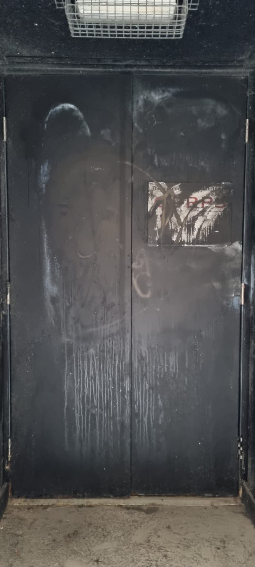 Vandalised back-of-house double doors prior to fire door replacement