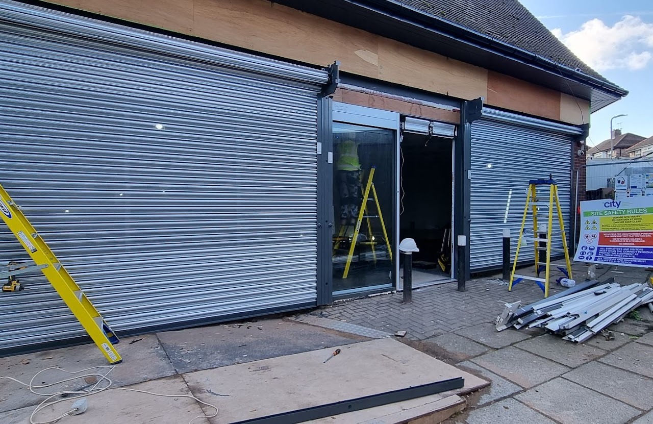 Aluminium shopfront, dark grey RAL finish