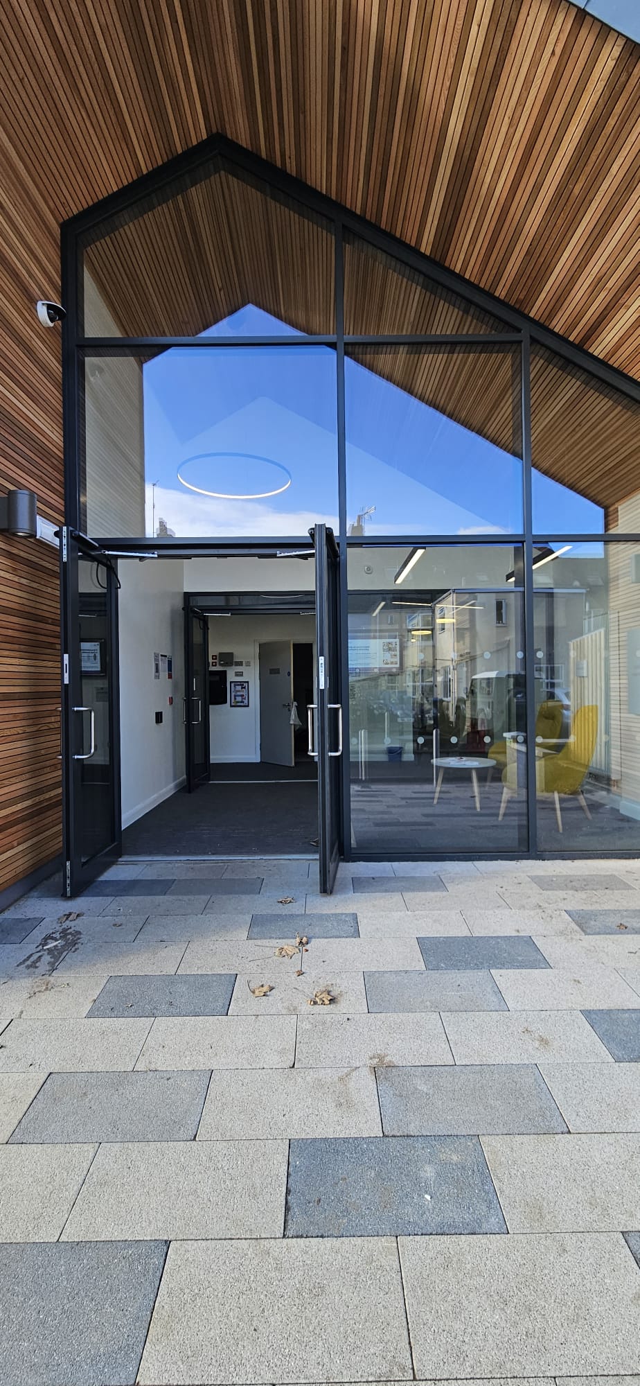 Telescopic automatic sliding doors installed at a commercial healthcare entrance in Scotland