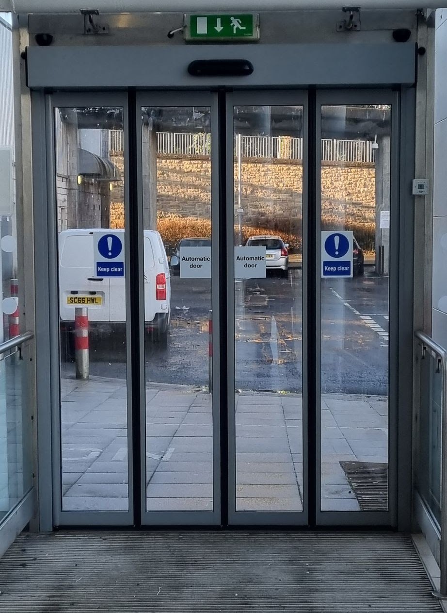 Access control fob reader at commercial entrance