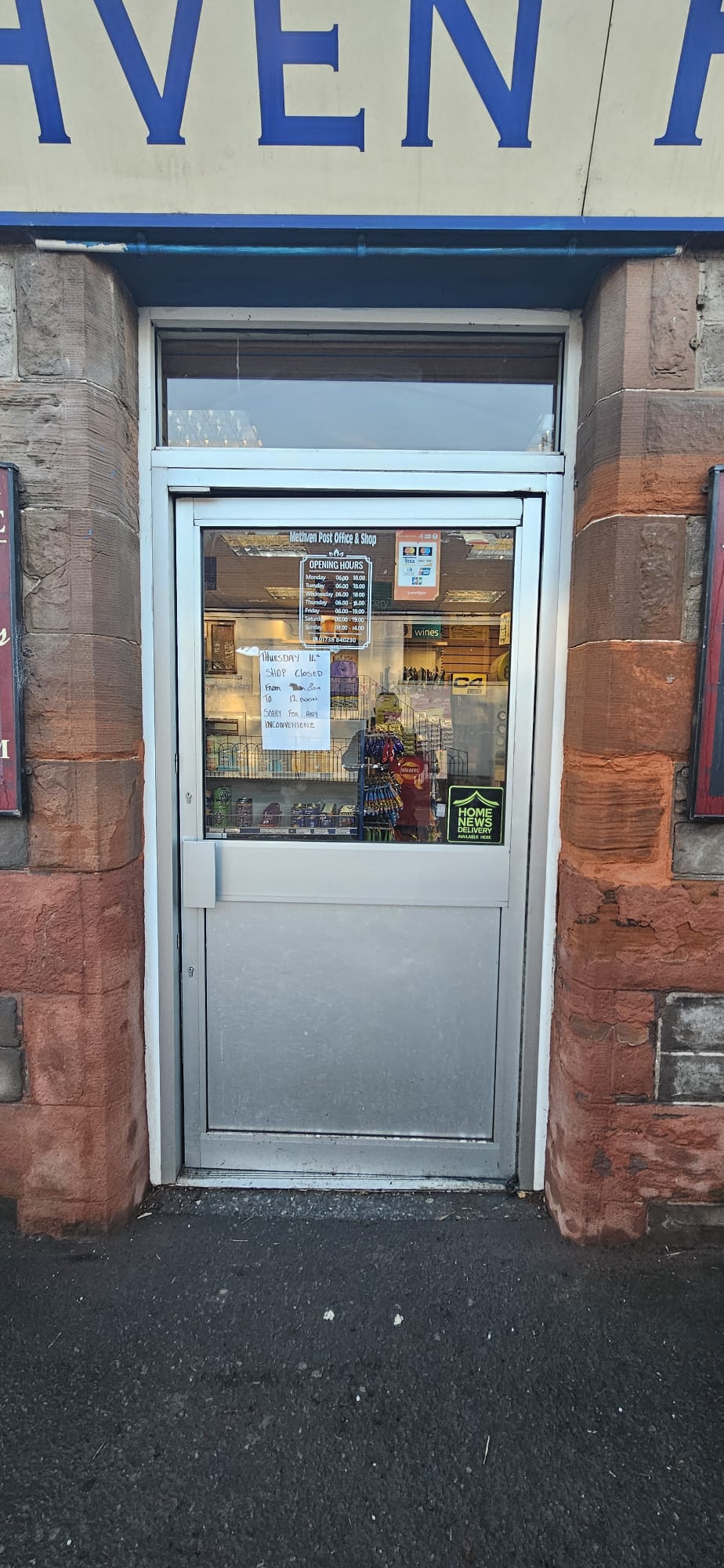 Half-glazed aluminium entrance door — stable-style lower panel, town-centre shop