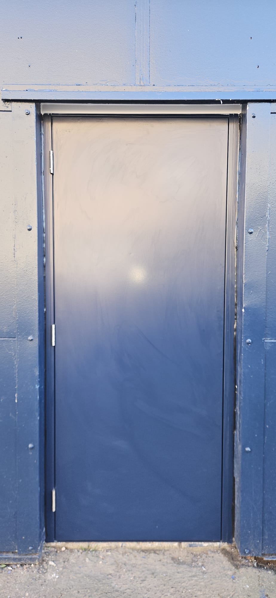 Single anthracite steel security door, navy-blue cladded reveal