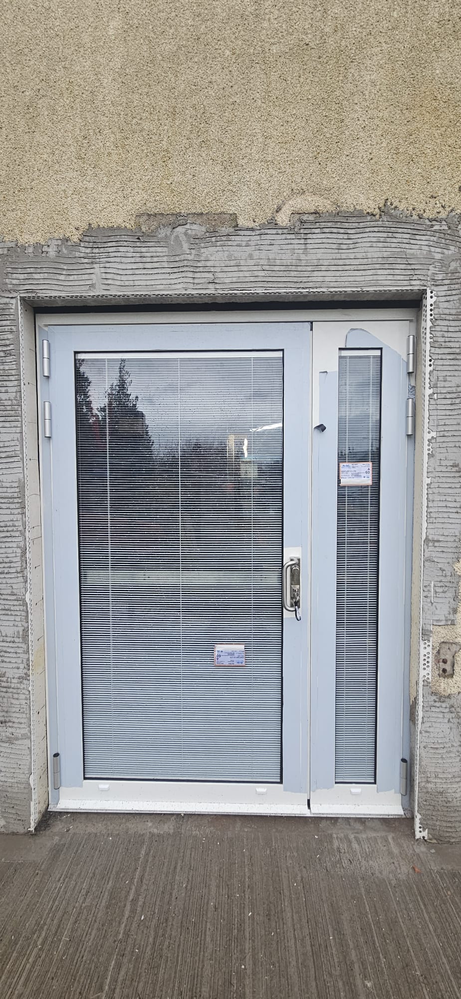 Powder-blue aluminium glazed entrance door with side-light, integral blinds