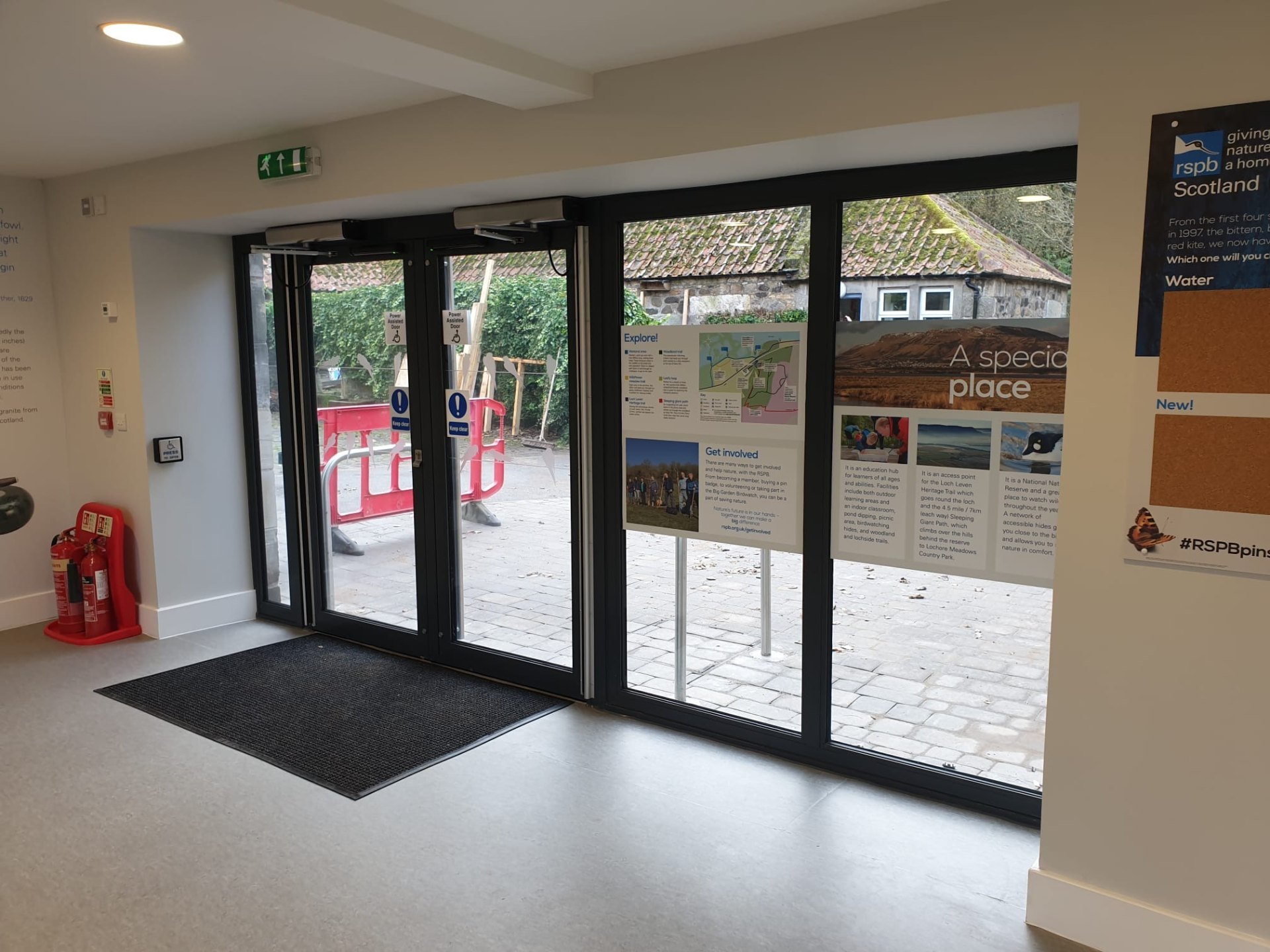 Power-assisted swing entrance doors at RSPB Loch Leven visitor centre interior
