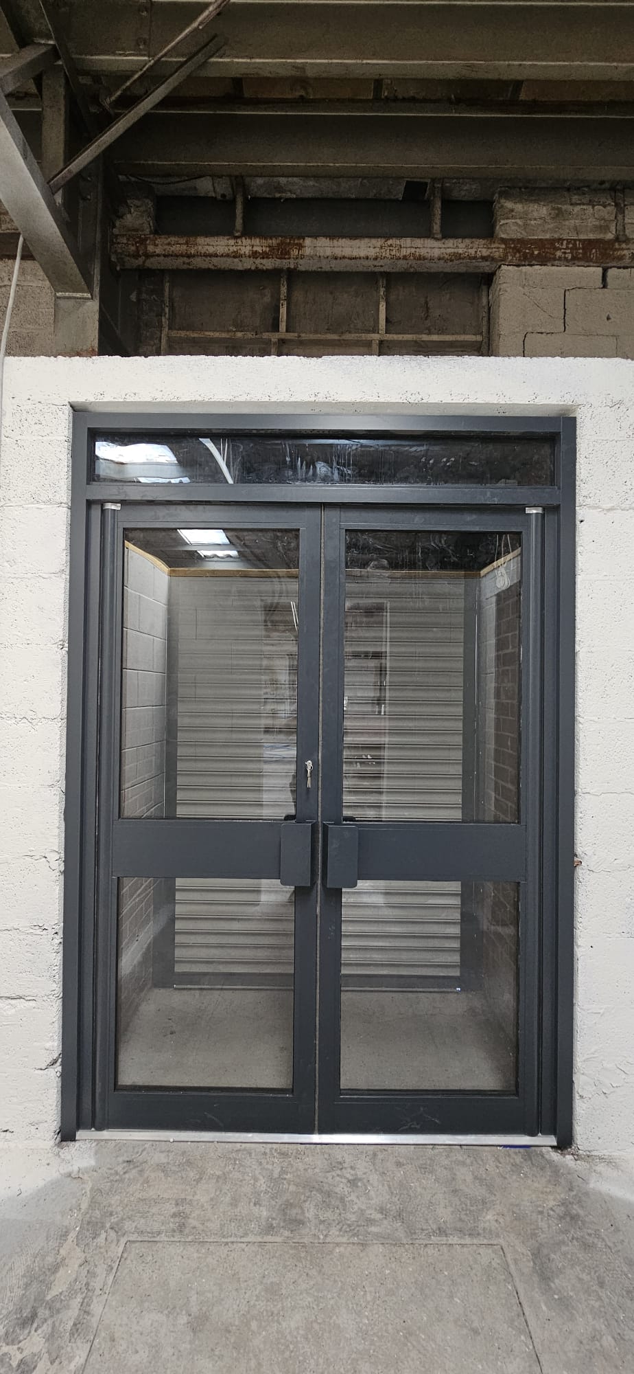 Anthracite aluminium double doors with side-lights and overhead transom